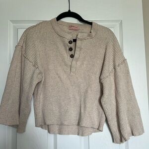 Cropped sweater with flared sleeves